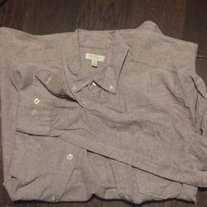 Long sleeved button up shirt. Reddish color